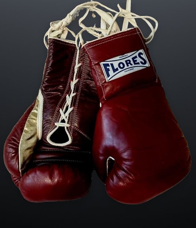 Oxblood FLORES gloves with the branded cuff plate and ribbon laces.
